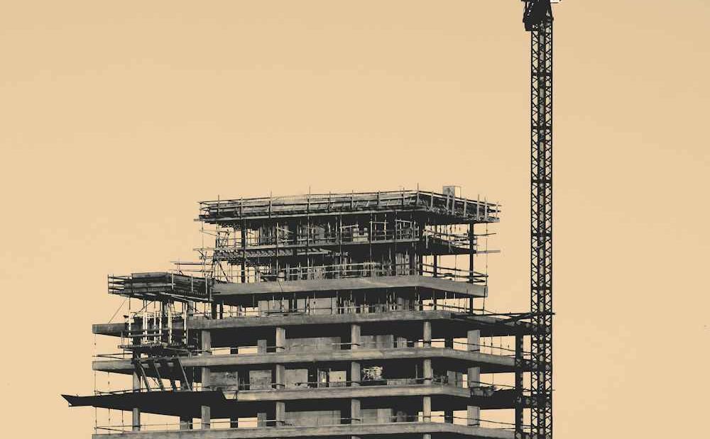 A new tower under construction beside a crane
